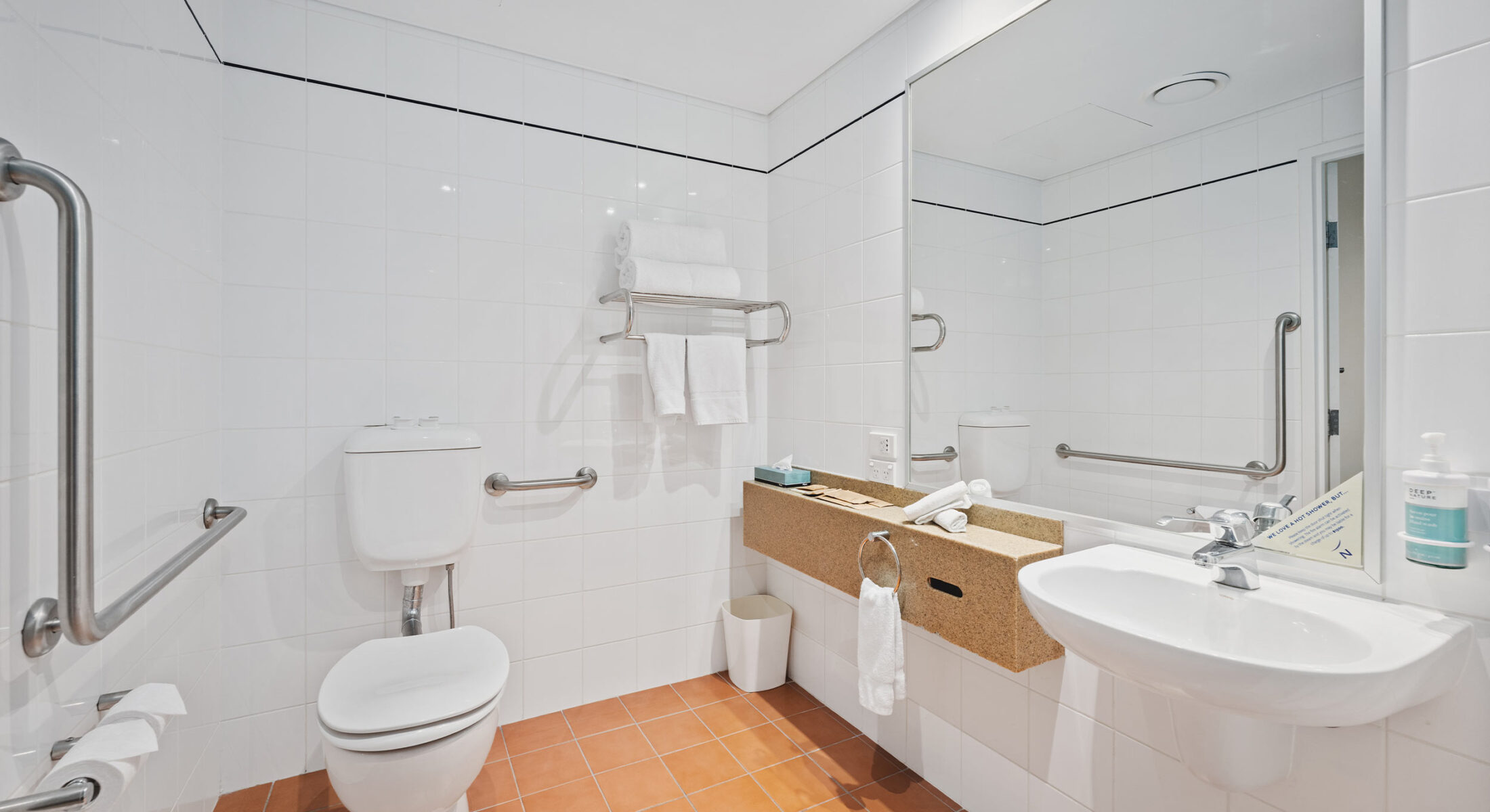 Novotel Canberra accessible room bathroom with rails and more space for mobility aids